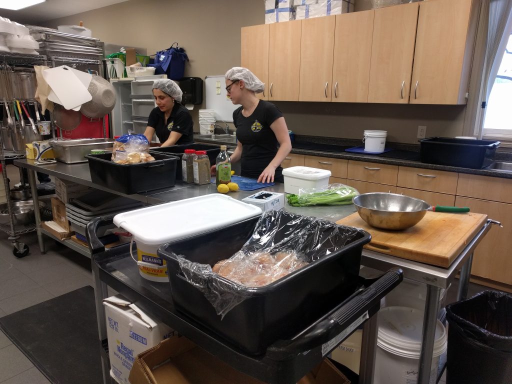 Beacon Ale House owners and staff at ACS preparing meal for Meals on Wheels.
